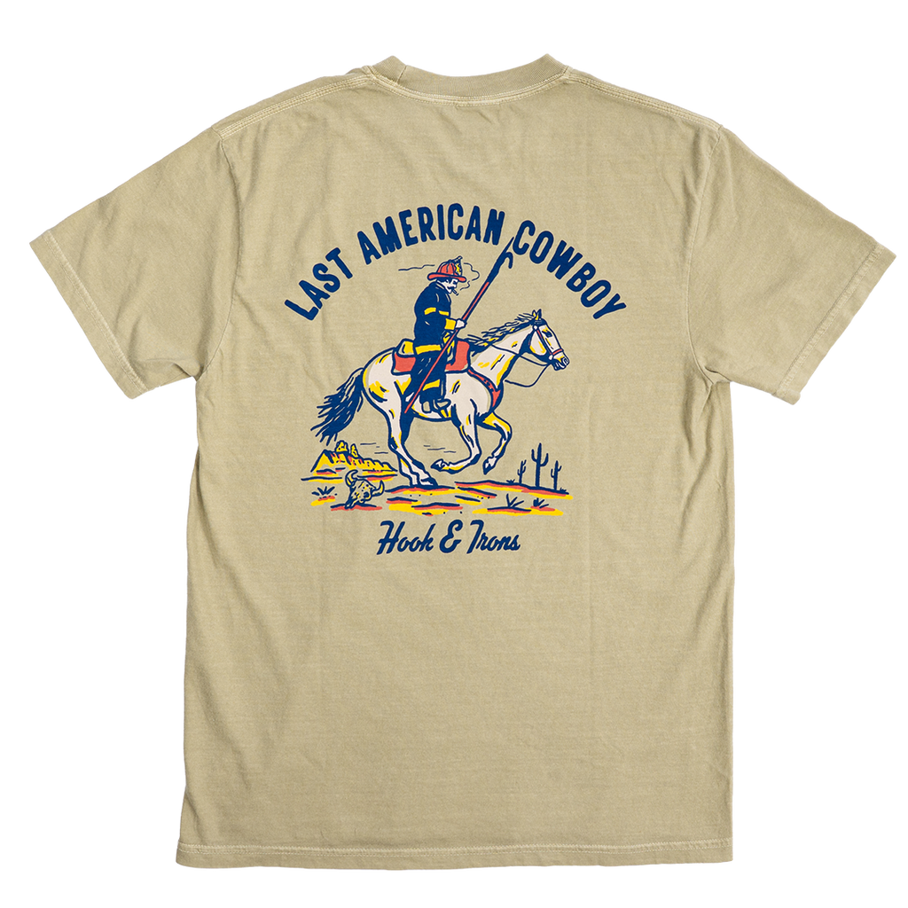 Khaki t-shirt with 'Last American Cowboy' graphic on a white background