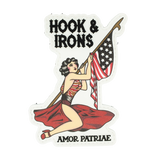PVC Patch with a woman holding an American flag and spear, text 'Hook & Irons' and 'Amor Patriae', on a white background.