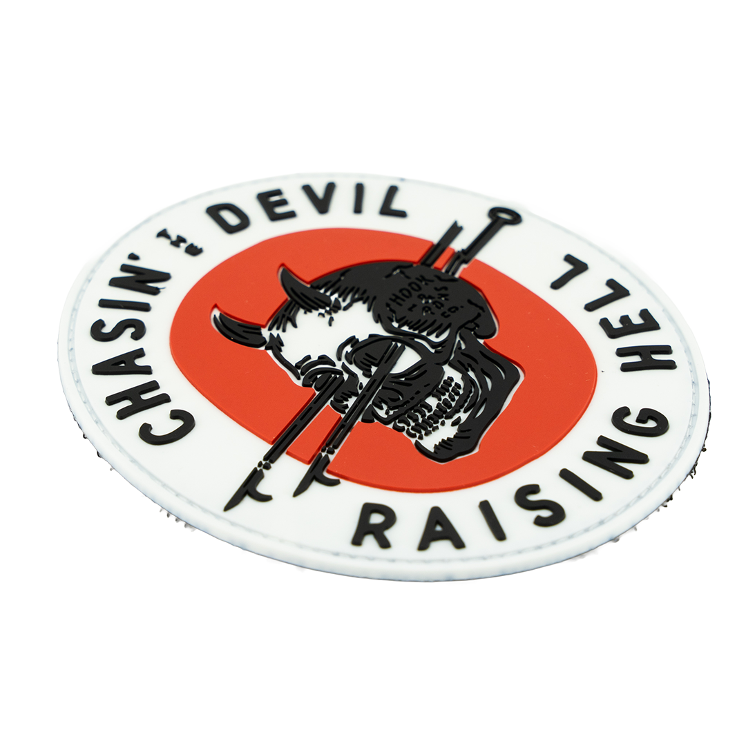 Round patch with skull design and text on a white background