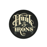 Round black patch with 'Hook & Irons Co.' text in gold on a white background
