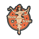 Decorative patch with a stylized woman and 'Hook & Irons' text on an orange background