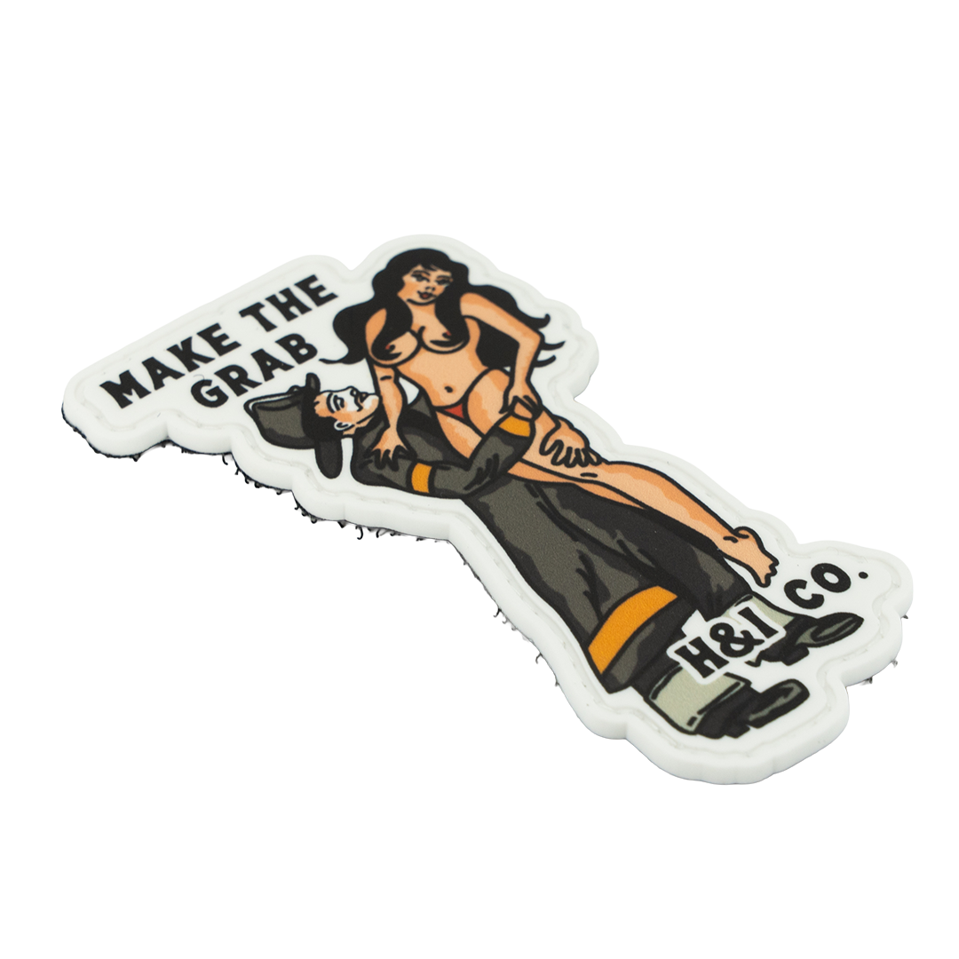 PVC Patch with a stylized illustration of a woman and text 'MAKE THE GRAB' and 'H&I CO' on a white background.