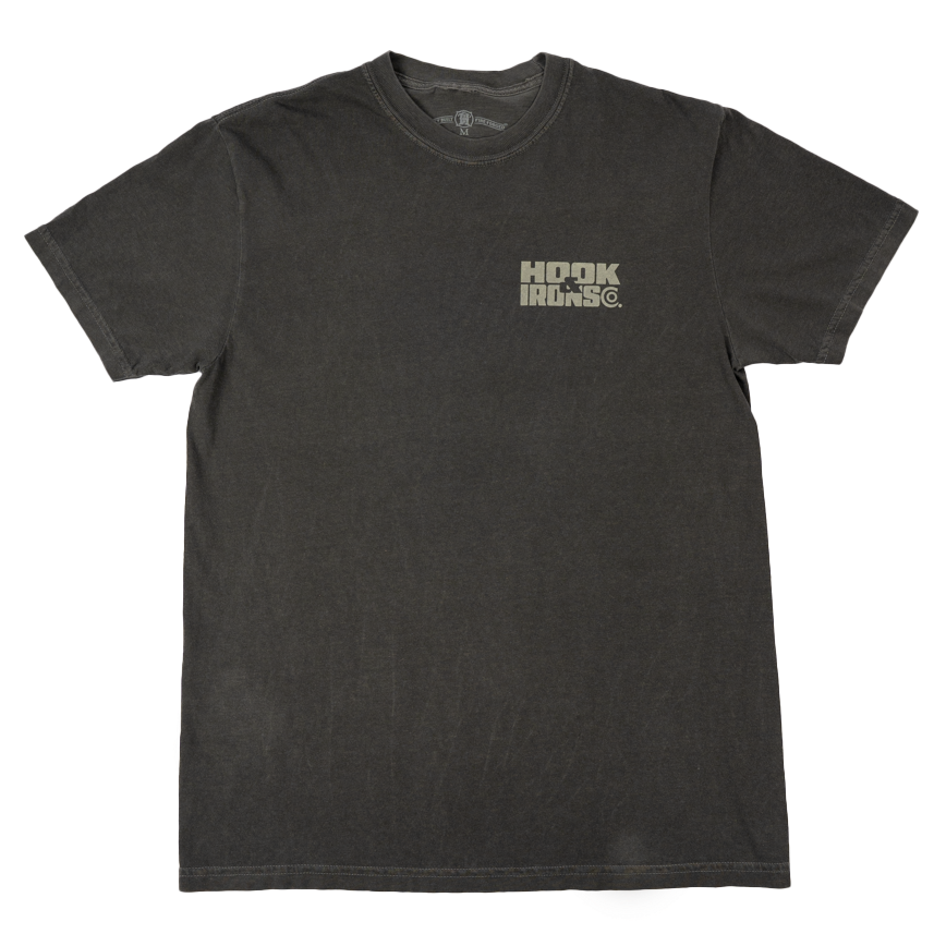 A dark charcoal gray short-sleeve t-shirt with a distressed wash, featuring a small distressed logo on the left chest that reads 'Hook and Irons'. The shirt is laid flat against a clean white background.