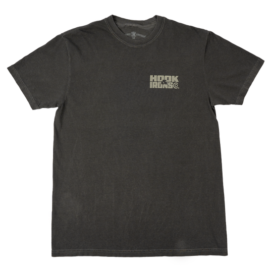 A dark charcoal gray short-sleeve t-shirt with a distressed wash, featuring a small distressed logo on the left chest that reads 'Hook and Irons'. The shirt is laid flat against a clean white background.