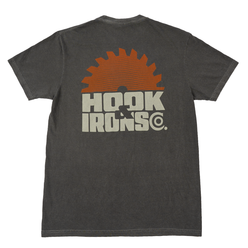 A dark gray heathered t-shirt shown from the back, featuring a large graphic print of an orange circular saw blade and the text 'HOOK IRONS CO.' in a distressed off-white font.