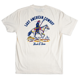 White t-shirt with a graphic of a cowboy on a horse and text 'Last American Cowboy' and 'Hook & Alberts'.