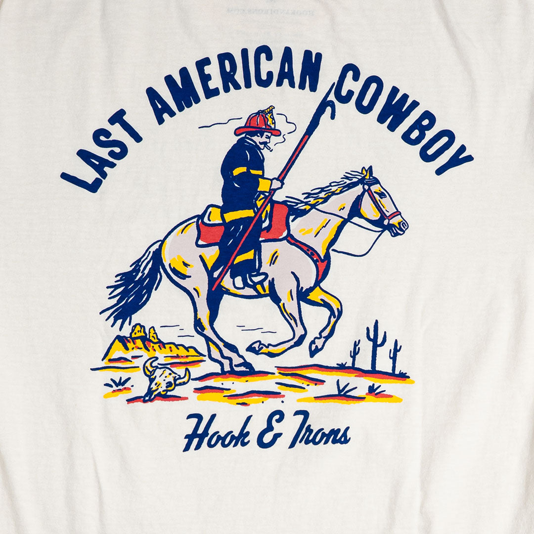 T-shirt with a graphic of a cowboy on a horse and 'Last American Cowboy' text, brand 'Hook & Irons' visible.